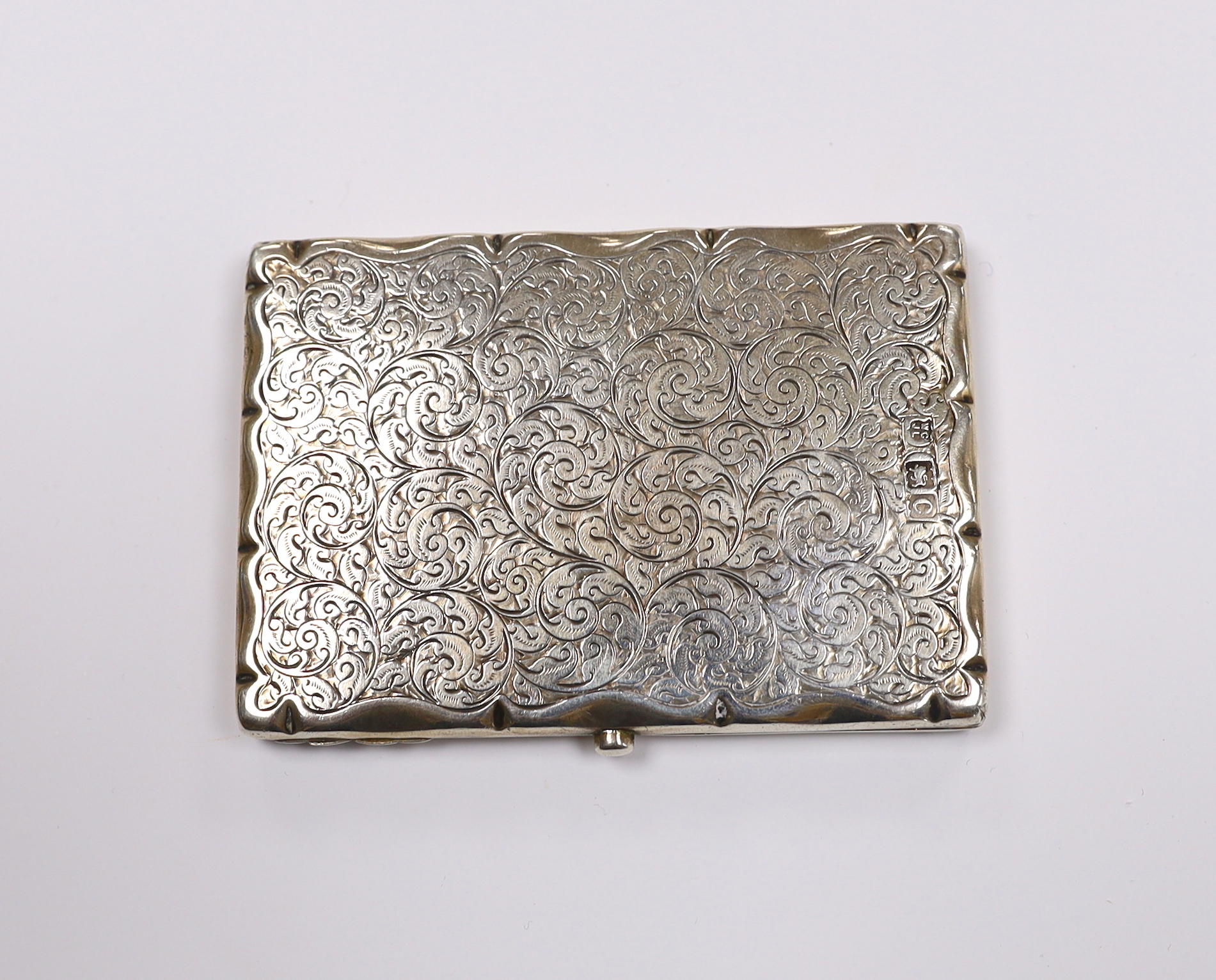 A late Victorian engraved silver mounted card purse, Goldsmiths & Silversmiths Co Ltd, London, 1898, 10.2cm.